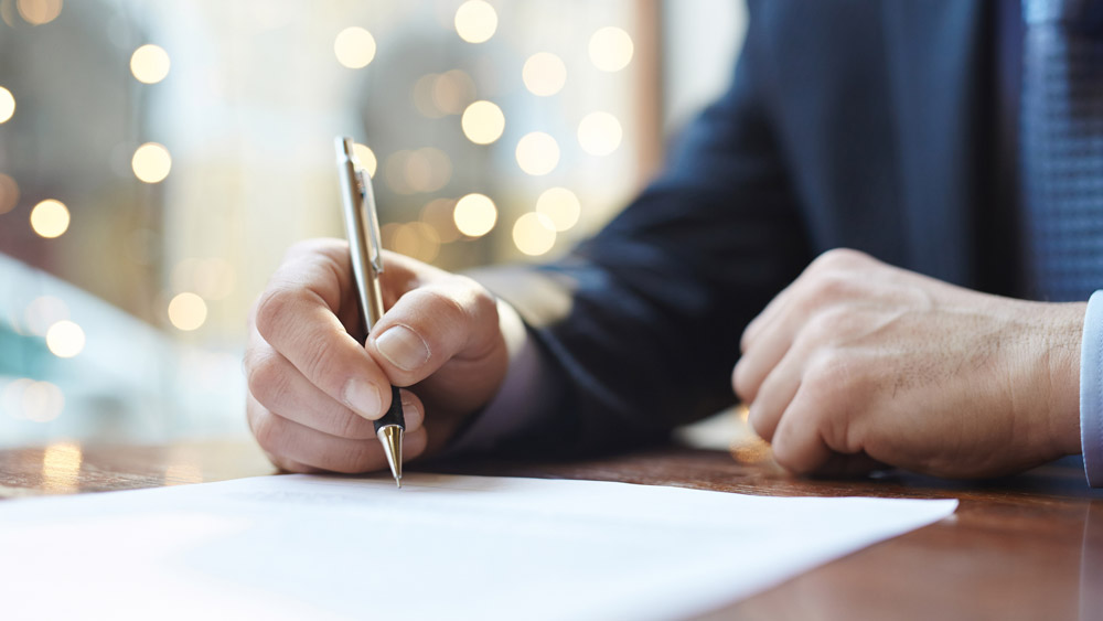 Writing with a pen on paper